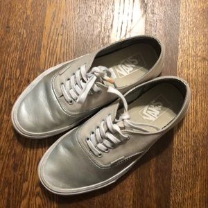 Tan and silver vans